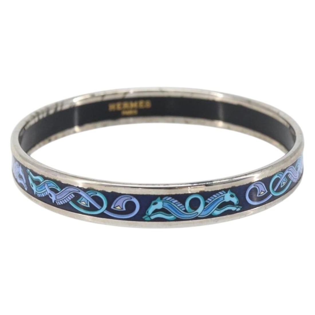 Navy Metal PM Bracelet by Hermes Made in Austria: Navy Metal PM Bracelet by Hermes Made in Austria This Hermes enamel PM metal bracelet features a navy color and metallic construction. Manufactured in Austria, it is designed in a classic bracelet sty