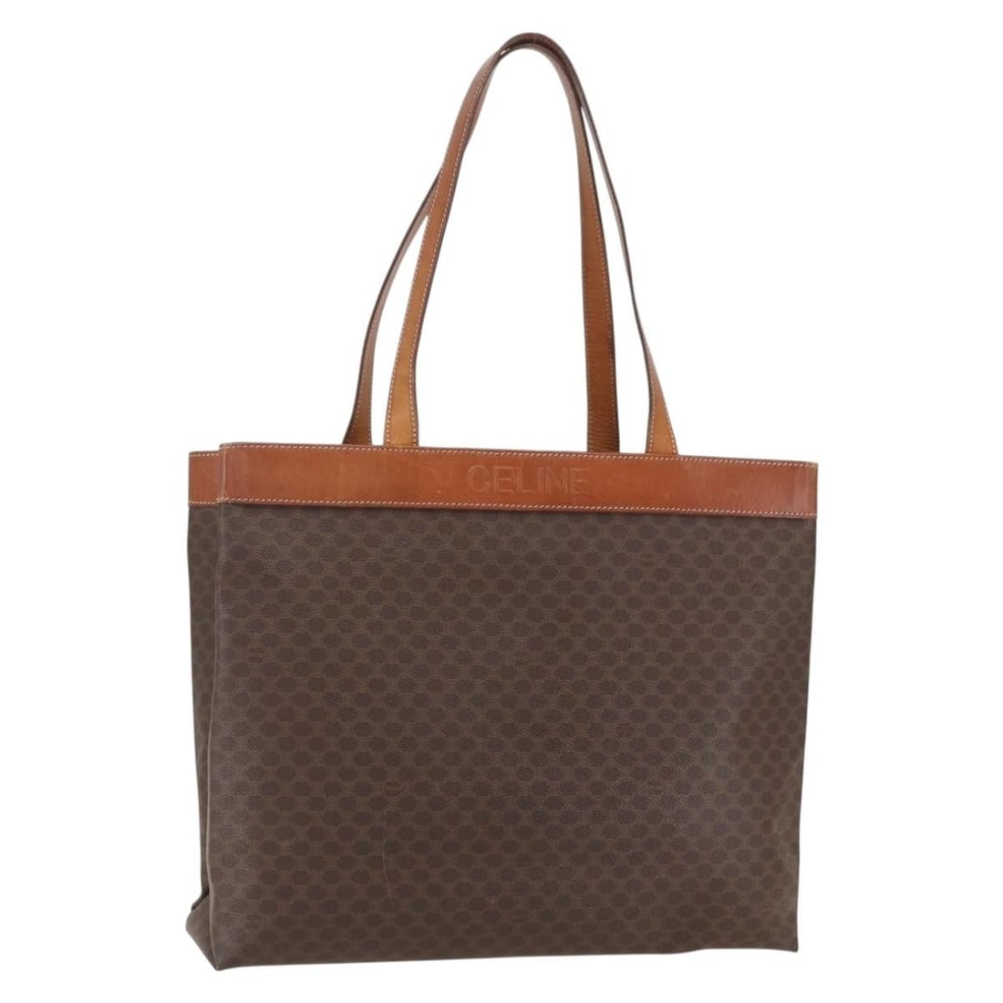 Celine Macadam Brown PVC Leather Tote Bag with Gold Accents from Italy: Celine Macadam Brown PVC Leather Tote Bag with Gold Accents from Italy This CELINE Macadam tote bag is crafted from PVC leather and Macadam canvas in a brown and gold color scheme. It features dual to