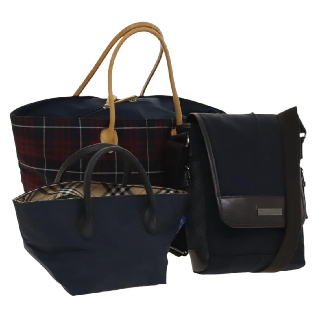 Burberrys Navy Beige Nylon Pouch Set of 3 Made in Japan: Burberrys Navy Beige Nylon Pouch Set of 3 Made in Japan This set features a trio of Burberrys Nova Check pouches, crafted from durable nylon in a sophisticated beige and navy color scheme. Designed fo