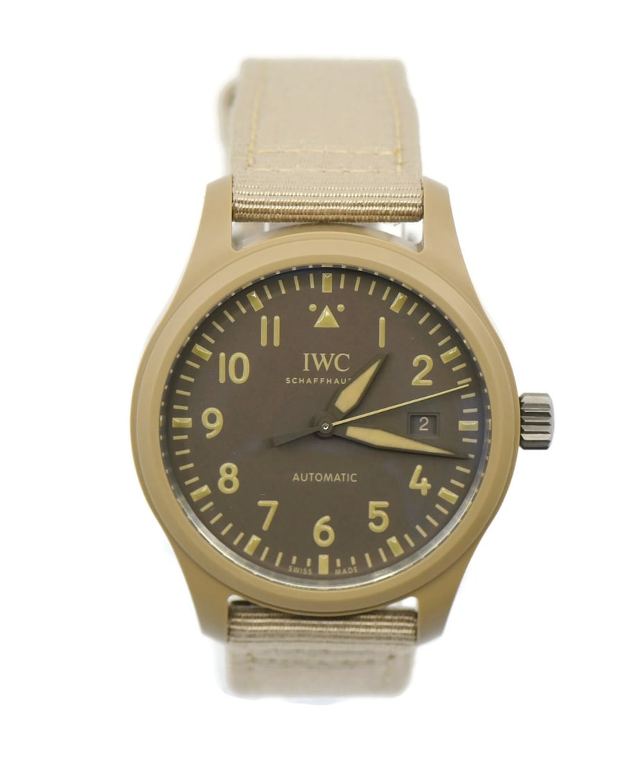 IWC Pilot Top Gun Ceramic Watch IW328106 41mm with Box and Papers: IWC Pilot Top Gun Ceramic Watch IW328106 41mm with Box and Papers Experience the precision and craftsmanship of the IWC Pilot Top Gun Ceramic Watch IW328106. This impressive wristwatch features a robu