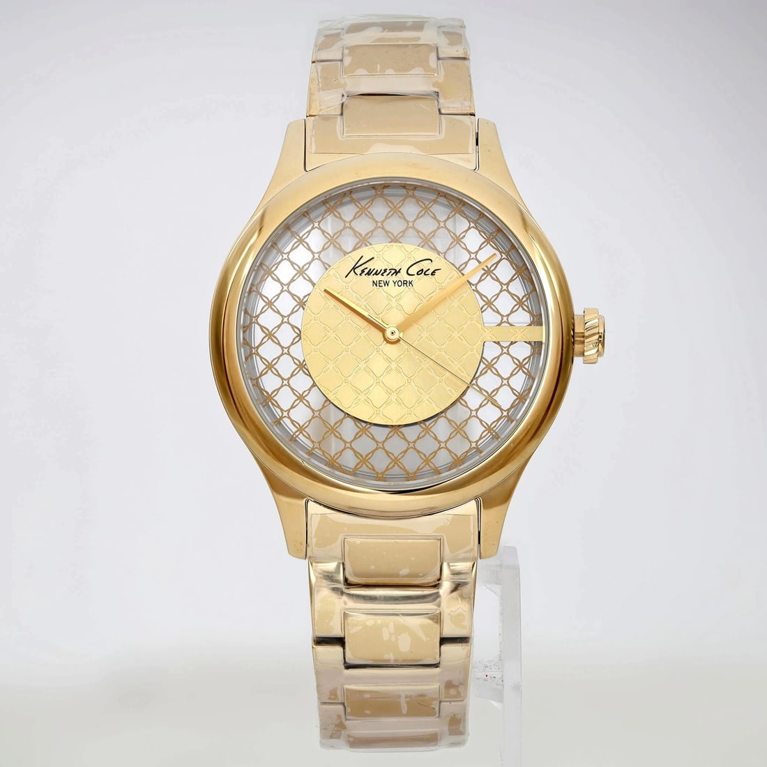 Kenneth Cole 38 mm Gold-Tone Quartz Ladies Watch KC10026010 Skeleton Dial: Kenneth Cole 38 mm Gold-Tone Quartz Ladies Watch KC10026010 Skeleton Dial This elegant Kenneth Cole wristwatch features a 38 mm round case crafted from polished stainless steel, complemented by a stri