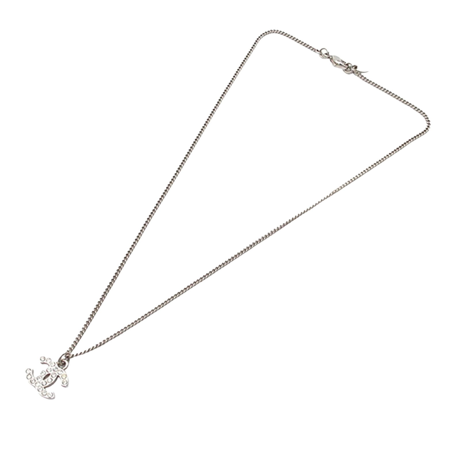 Chanel Silver Tone Necklace with Rhinestone CC Pendant: Chanel Silver Tone Necklace with Rhinestone CC Pendant This Chanel necklace features a silver-tone pendant adorned with rhinestones and is paired with a matching silver-tone chain. The necklace is sec