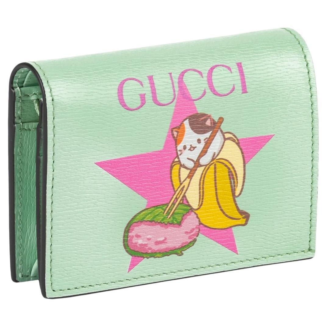 Gucci Bananya Limited Edition Mint Green Wallet with Gold Tone Hardware: Gucci Bananya Limited Edition Mint Green Wallet with Gold Tone Hardware Introducing the Gucci Bananya Sakuramochi Wallet, a stunning limited-edition accessory crafted for style and functionality. This
