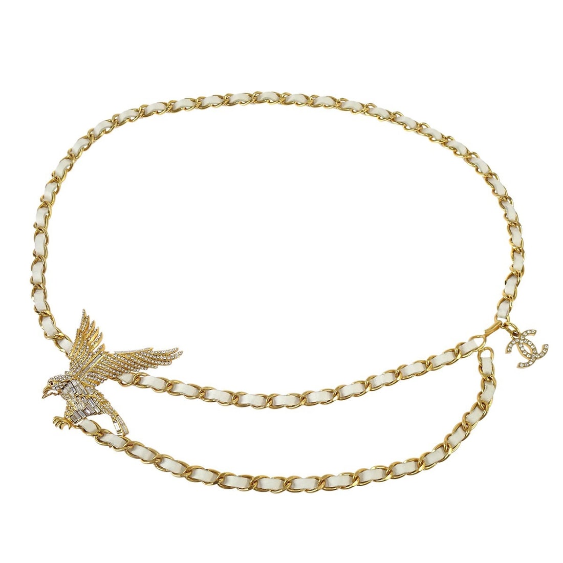 Chanel Vintage Eagle Rhinestone Chain Waist Belt White Gold: Chanel Vintage Eagle Rhinestone Chain Waist Belt White Gold Introducing a stunning vintage Chanel Eagle Rhinestone Chain Belt, crafted in a luxurious white gold color. This stylish waist belt features