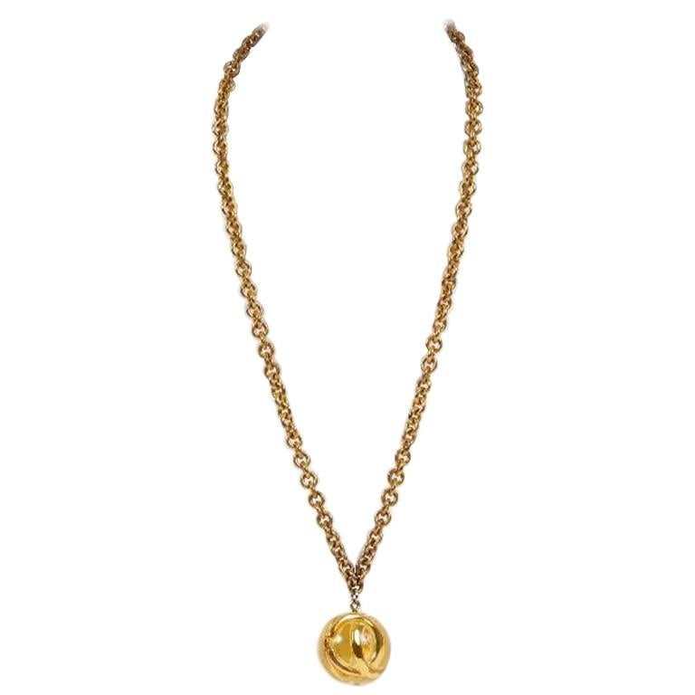 1980s Vintage Chanel Lucite Sphere Pendant Necklace with Pouch: 1980s Vintage Chanel Lucite Sphere Pendant Necklace with Pouch This stunning 1980s Chanel necklace features a unique Lucite sphere pendant, making it a standout accessory for collectors and fashion en