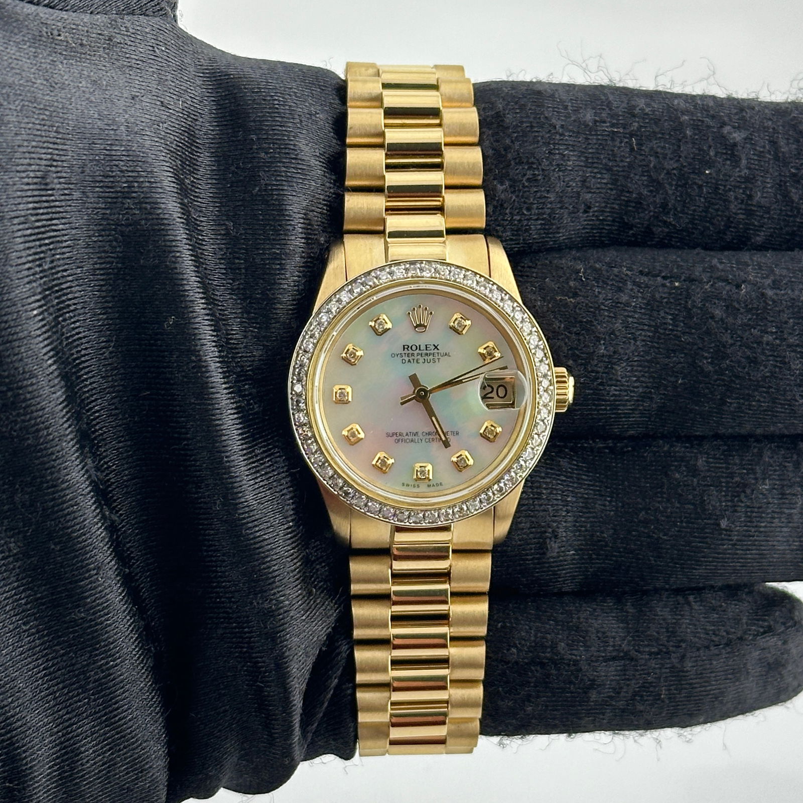 Ladies Datejust 6827 Aftermarket Mother of Pearl Diamond Dial on Aftermarket Presi 18K: Ladies Datejust 6827 Aftermarket Mother of Pearl Diamond Dial on Aftermarket Presi 18K This ladies Rolex Datejust features an aftermarket white mother-of-pearl diamond dial, a pave 10K diamond bezel,