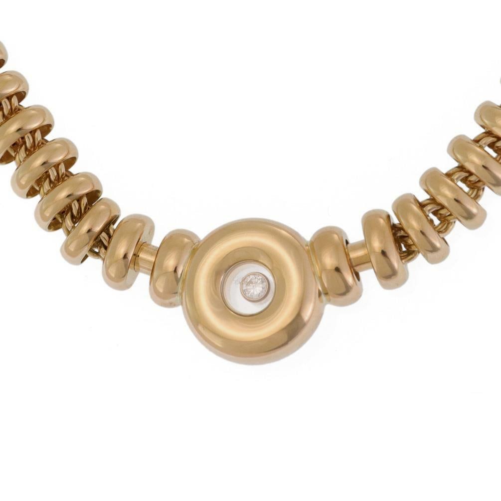 Chopard Happy Diamond 18k Yellow Gold Pendant Necklace with Floating Diamond: Chopard Happy Diamond 18k Yellow Gold Pendant Necklace with Floating Diamond Introducing an exquisite necklace from the prestigious Chopard Happy Diamond Collection. This elegant piece is meticulously
