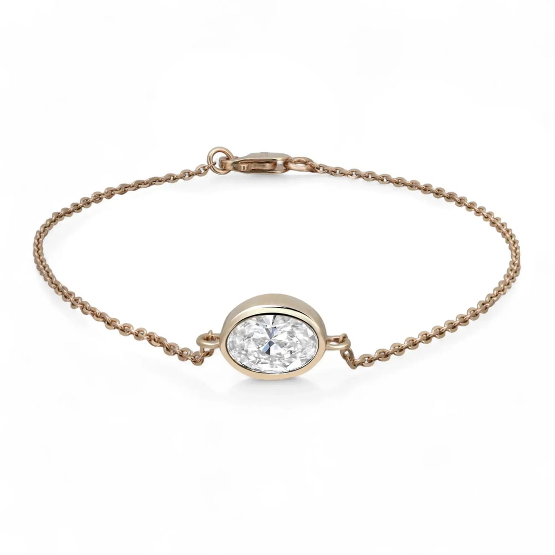 Rachel Koen 14K Yellow Gold Bezel Set Lab Grown Diamond Bracelet 1.00Ctw: Rachel Koen 14K Yellow Gold Bezel Set Lab Grown Diamond Bracelet 1.00Ctw This exquisite bracelet features a stunning bezel set oval cut lab-grown diamond, elegantly crafted in 14K yellow gold. The cen