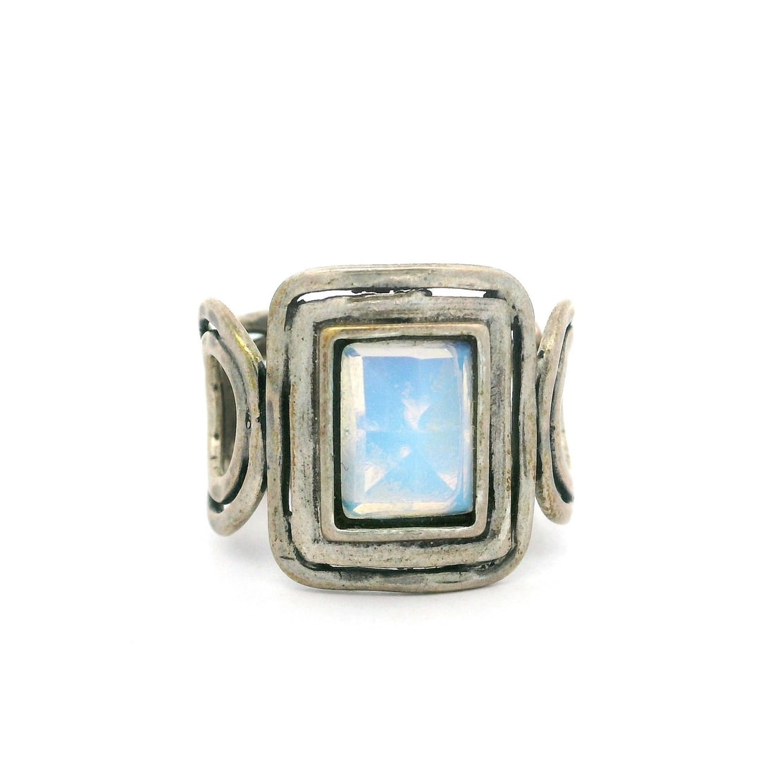 Vintage Sterling Silver Geometric Opal Cocktail Ring 6.5: Vintage Sterling Silver Geometric Opal Cocktail Ring 6.5 This vintage cocktail ring showcases a stunning rectangular milky opal, elegantly set within an open geometric design. The opal is a synthetic