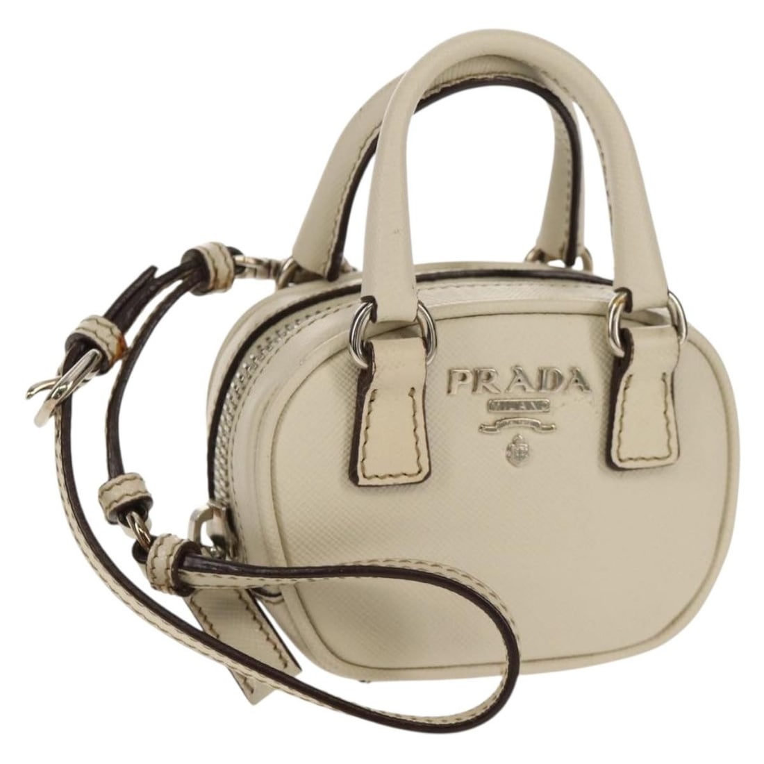 Ivory Saffiano Leather Pouch by PRADA with Silver Tone Details: Ivory Saffiano Leather Pouch by PRADA with Silver Tone Details This Prada pouch is crafted from Saffiano leather in an elegant ivory and silver color combination. Made in Italy, it features a compact