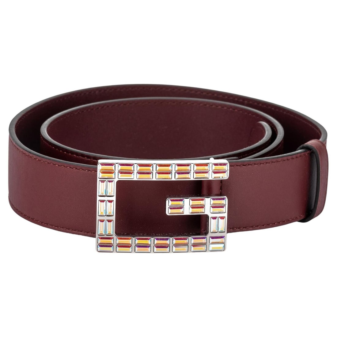 Gucci Burgundy Leather Belt with Iridescent Crystal Buckle: Gucci Burgundy Leather Belt with Iridescent Crystal Buckle This exquisite Gucci belt features a striking dark red iridescent crystal buckle, enhancing its luxurious appeal. Crafted from high-quality b