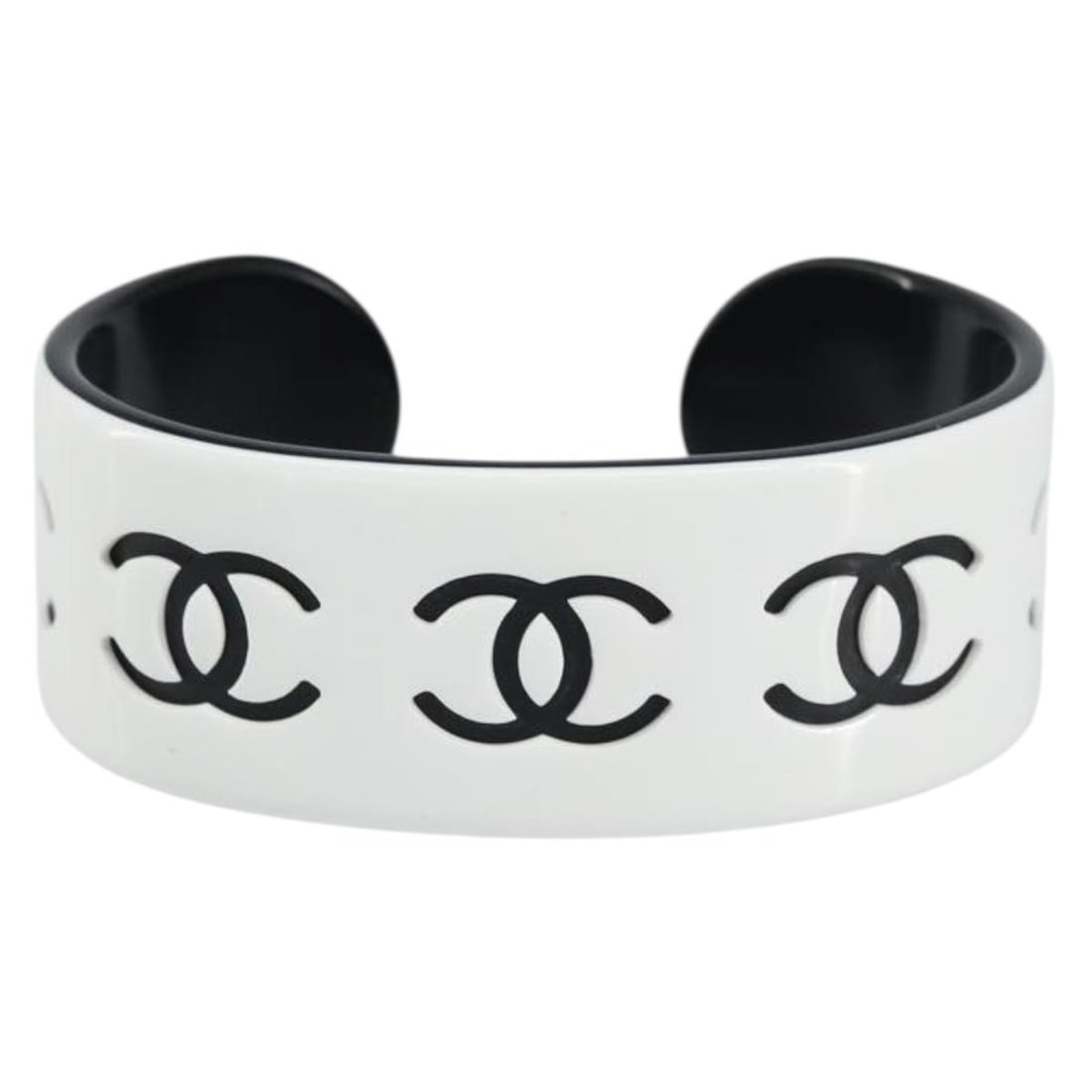 White Coco Cuff Bracelet by Chanel 15cm Length: White Coco Cuff Bracelet by Chanel 15cm Length This pre-owned Chanel Coco cuff bracelet features a white design and is in excellent condition with minimal signs of wear, including slight surface rubbi