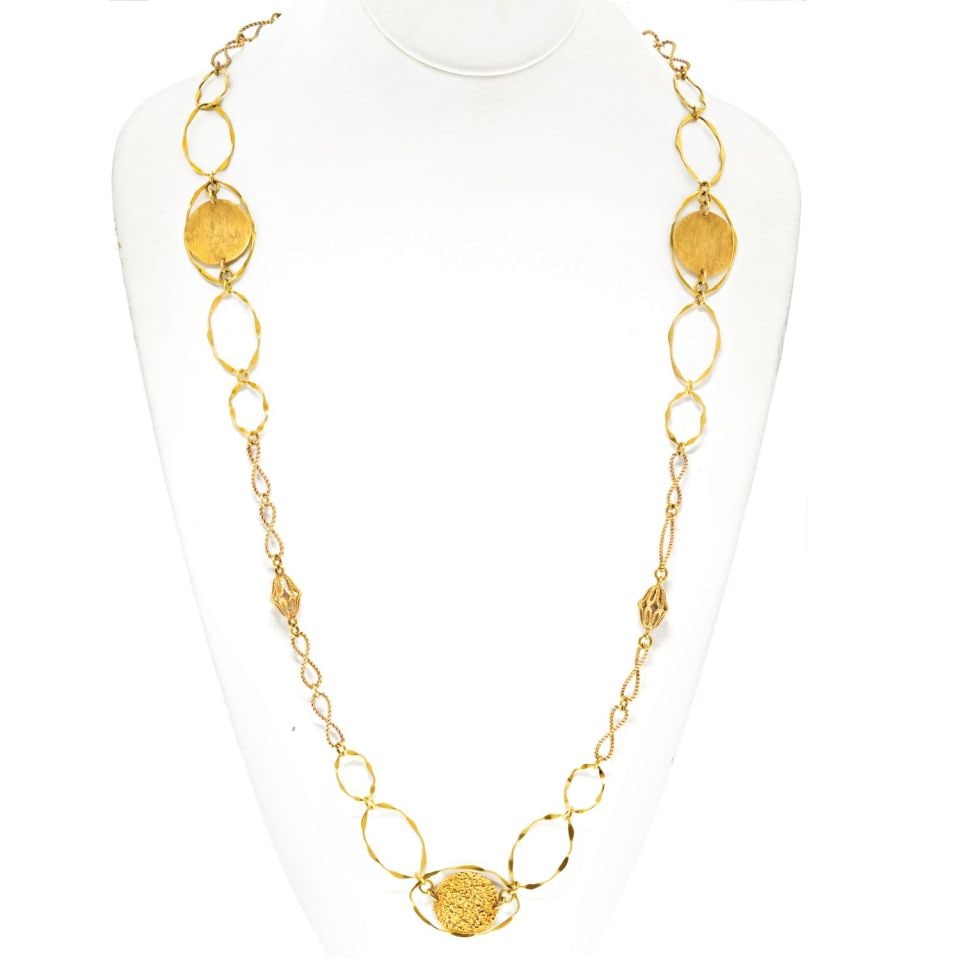 Cartier 1970s 18K Yellow Gold Wire Twist Disk Necklace: Cartier 1970s 18K Yellow Gold Wire Twist Disk Necklace This Cartier Vintage 18K Yellow Gold Wire Twist Disk Chain Necklace from the 1970s is a rare and elegant find. Measuring 34 inches in length and