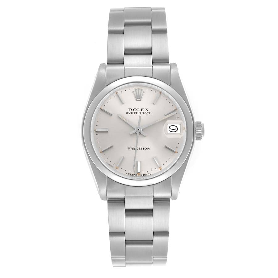 Ladies Rolex 6466 Oyster Date Watch Silver Dial with Papers 1987: Ladies Rolex 6466 Oyster Date Watch Silver Dial with Papers 1987 This Rolex Oyster Date wristwatch for ladies features a silver dial, a smooth bezel, and is paired with the signature Oyster bracelet.