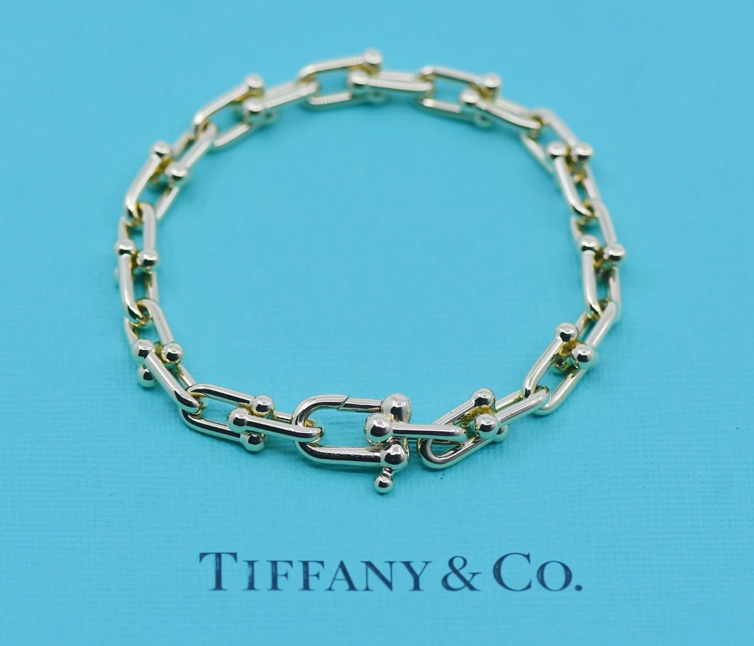 18K Yellow Gold Small Link Bracelet by Tiffany Hardwear Collection: 18K Yellow Gold Small Link Bracelet by Tiffany Hardwear Collection This Tiffany & Co. Hardwear Small Link bracelet features a chain style crafted from 18k yellow gold. The bracelet is pre-owned and do