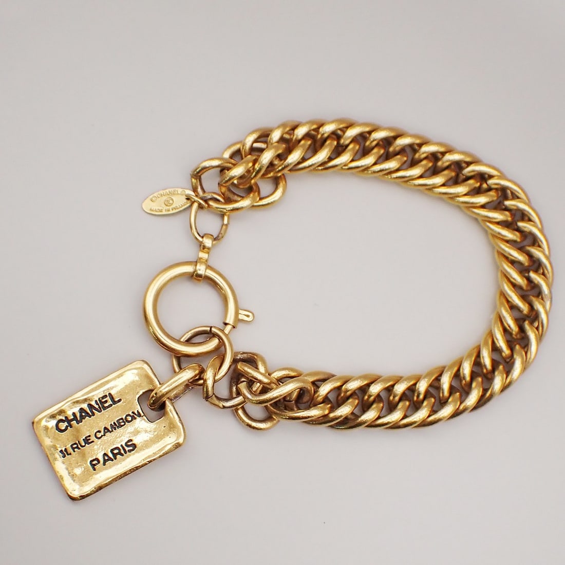 Vintage Chanel Gold Plated Chain Bracelet with Rue Cambon Charms: Vintage Chanel Gold Plated Chain Bracelet with Rue Cambon Charms This Chanel Vintage Rue Cambon chain charm bracelet features gold-plated charms and a classic chain design. It is designed for female w