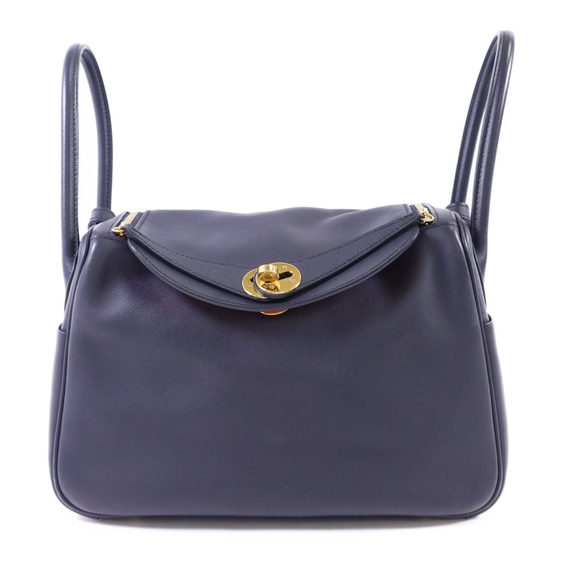 Hermes Lindy 26 Blue Veau Swift Leather Shoulder Bag with Gold Hardware: Hermes Lindy 26 Blue Veau Swift Leather Shoulder Bag with Gold Hardware This Hermes Lindy 26 is a versatile 2-way shoulder bag crafted from Veau Swift calfskin leather in deep blue. Featuring a regula