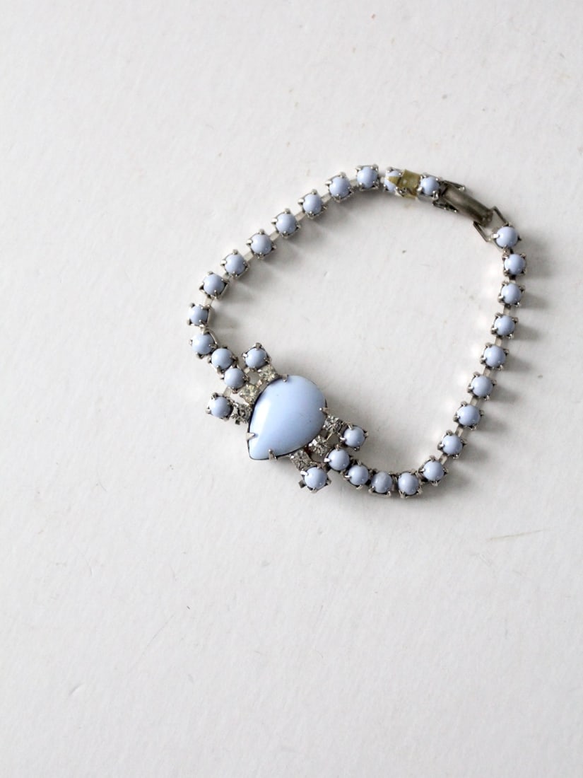 1950s Vintage Costume Jewelry Bracelet with Periwinkle Stones: 1950s Vintage Costume Jewelry Bracelet with Periwinkle Stones This charming vintage costume jewelry bracelet from the 1950s features beautiful periwinkle faux stone insets complemented by sparkling rh