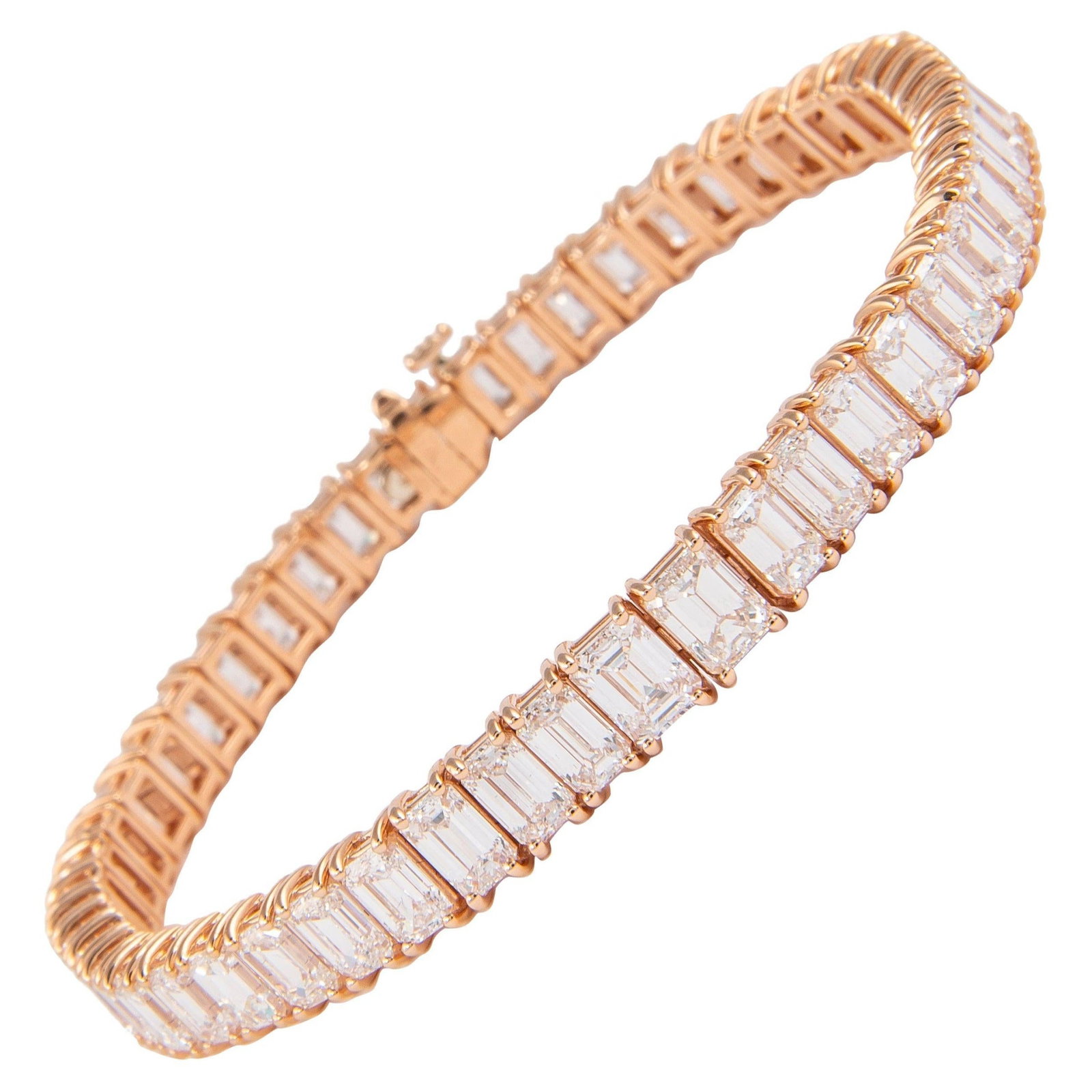 17.32ct Emerald Cut Diamond Bracelet in 18k Rose Gold: 17.32ct Emerald Cut Diamond Bracelet in 18k Rose Gold Experience the elegance of this stunning contemporary emerald cut diamond tennis bracelet, crafted from 18k rose gold. Featuring 51 emerald cut di