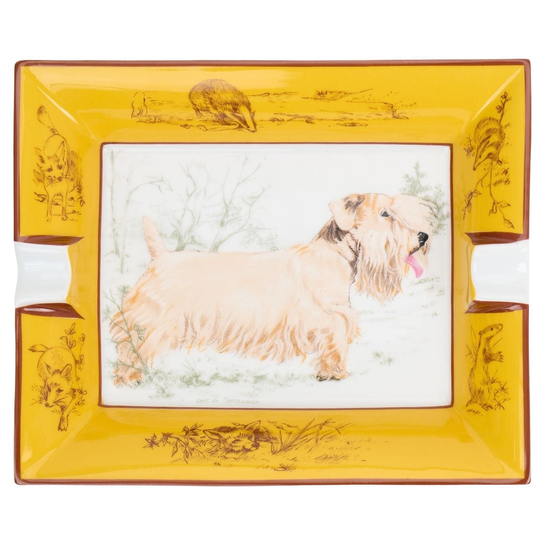 Hermes Sealyham Terrier Porcelain Ashtray by Carl de Parcevaux: Hermes Sealyham Terrier Porcelain Ashtray by Carl de Parcevaux This exquisite Hermes Sealyham Terrier ashtray is a charming addition to any collection. Crafted from fine porcelain and designed by Carl