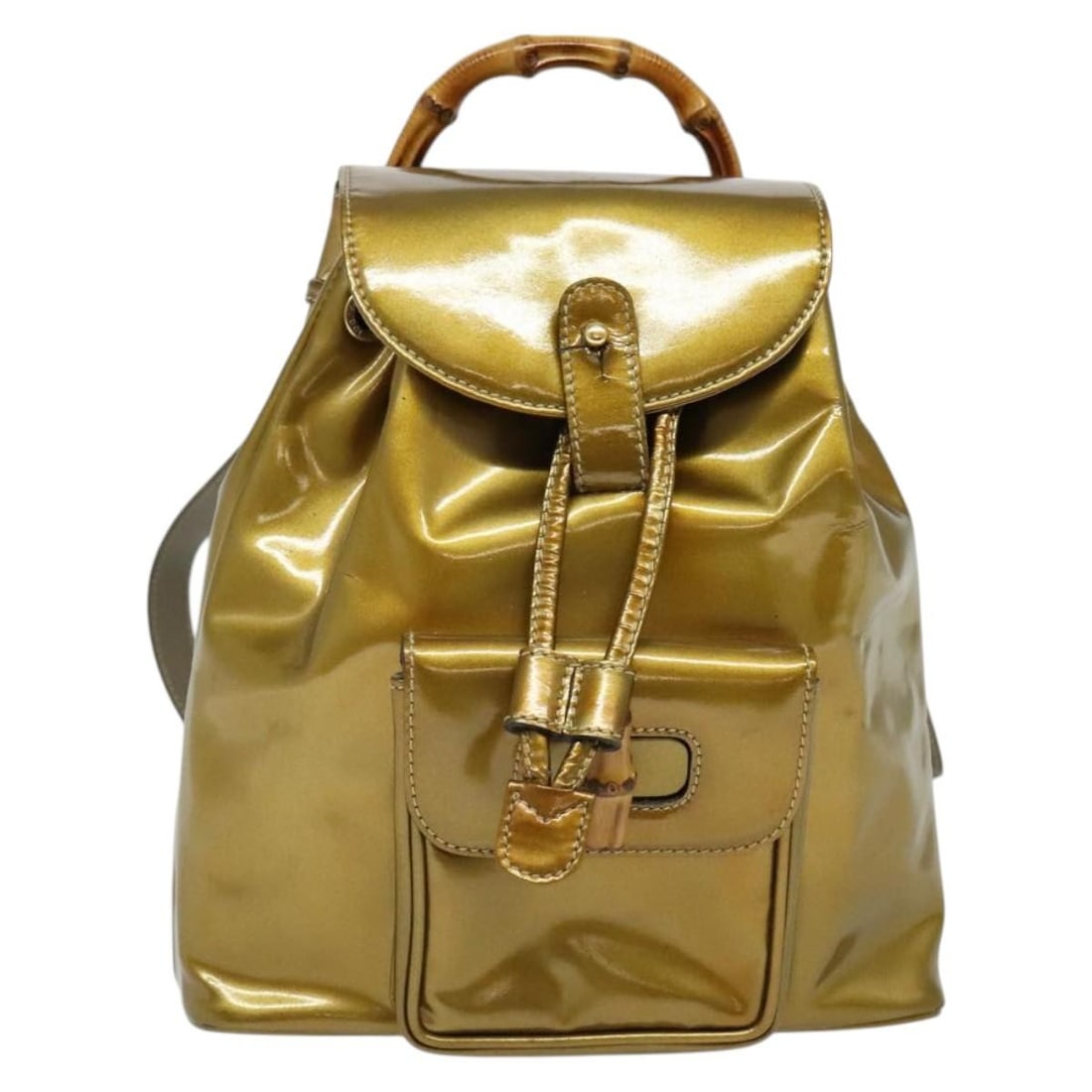 Vintage Bamboo Backpack by Gucci with Gold Tone Details: Vintage Bamboo Backpack by Gucci with Gold Tone Details This is a Gucci vintage bamboo backpack designed for women. The item shows signs of wear, including rubbing, sunburn, and deformation on the ext