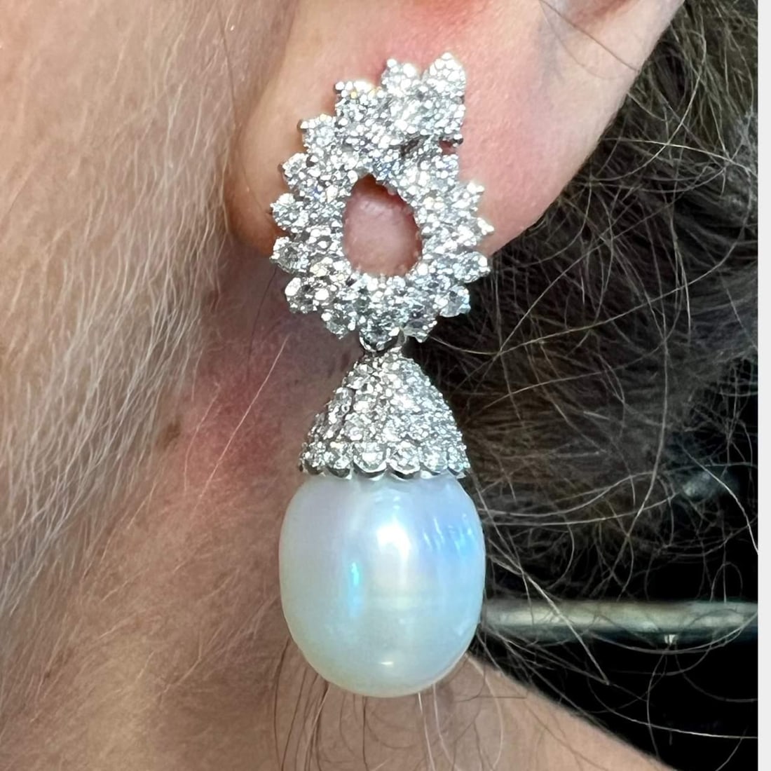 Platinum Earrings with 5.50 Ct Diamonds and South Sea Pearls: Platinum Earrings with 5.50 Ct Diamonds and South Sea Pearls Elevate your elegance with these stunning Platinum Earrings featuring 5.50 Ct. of Diamonds and exquisite South Sea Pearls. Crafted in lustr