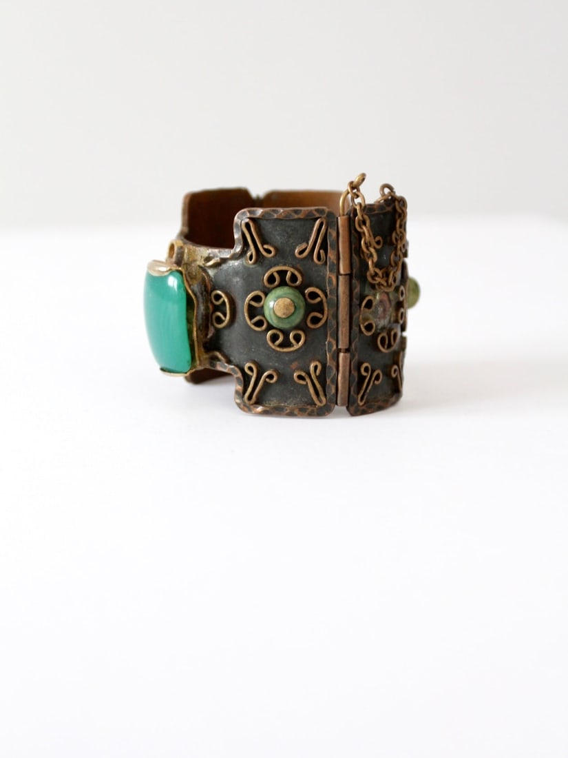 1950s Casa Maya Copper Bangle Aztec Modernist Design with Green Onyx: 1950s Casa Maya Copper Bangle Aztec Modernist Design with Green Onyx Discover a stunning piece from the 1950s with this vintage Casa Maya copper bangle. This bracelet showcases a beautifully crafted A