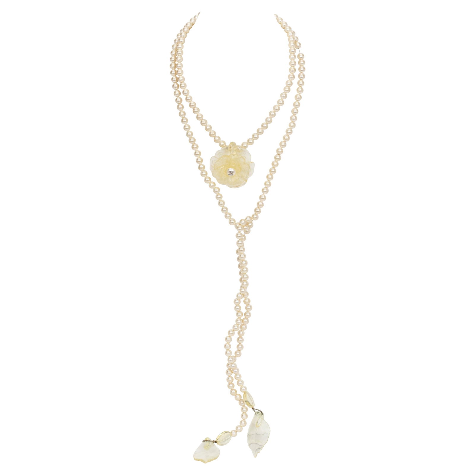1990s Chanel Long Pearl Necklace Camellia CC Logo: 1990s Chanel Long Pearl Necklace Camellia CC Logo This exquisite 1990's Chanel Long Pearl Necklace features a stunning design with a lucite camellia flower at its center, adorned with pearls and the i