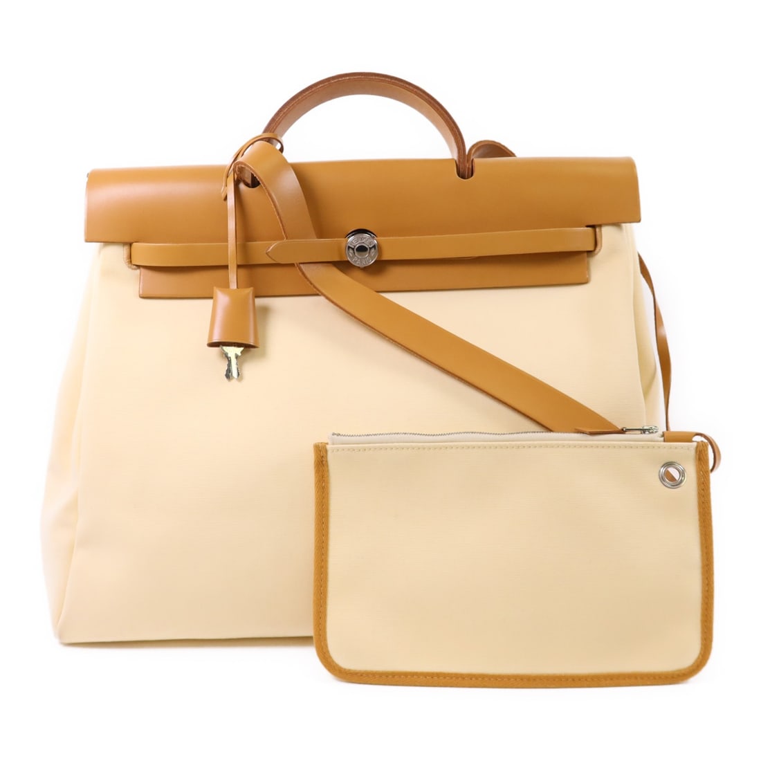 HERMES Herbag MM 2 Way Shoulder Bag Beige Canvas: HERMES Herbag MM 2 Way Shoulder Bag Beige Canvas This HERMES Herbag MM 2 Way Shoulder Bag is a stylish and versatile accessory, crafted from durable canvas in a timeless beige color. Designed for both