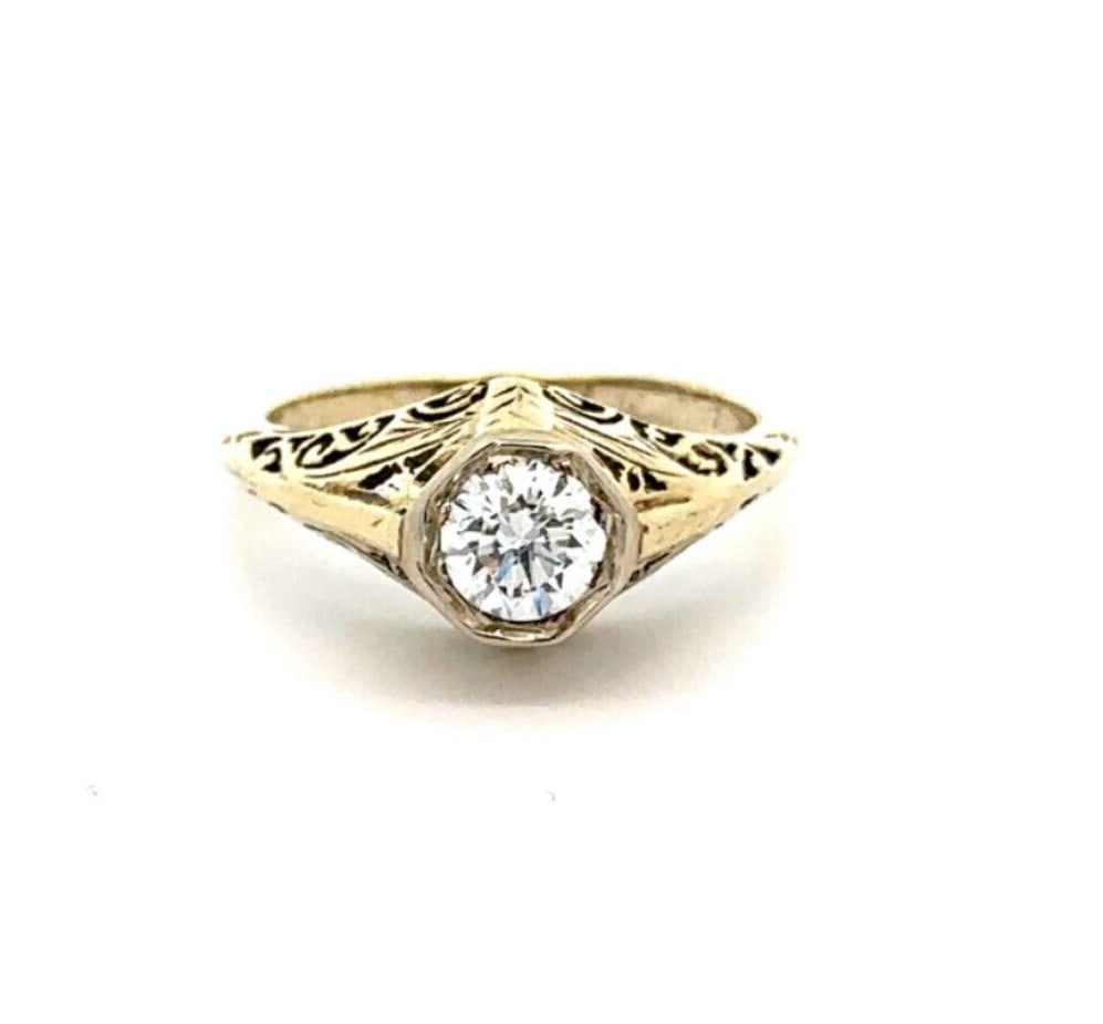 Antique Gold 0.58ct Old Transitional Cut Diamond Filigree Ring: Antique Gold 0.58ct Old Transitional Cut Diamond Filigree Ring This exquisite antique engagement ring showcases a stunning 0.58ct old transitional cut diamond, elegantly set in a filigree design. Craf