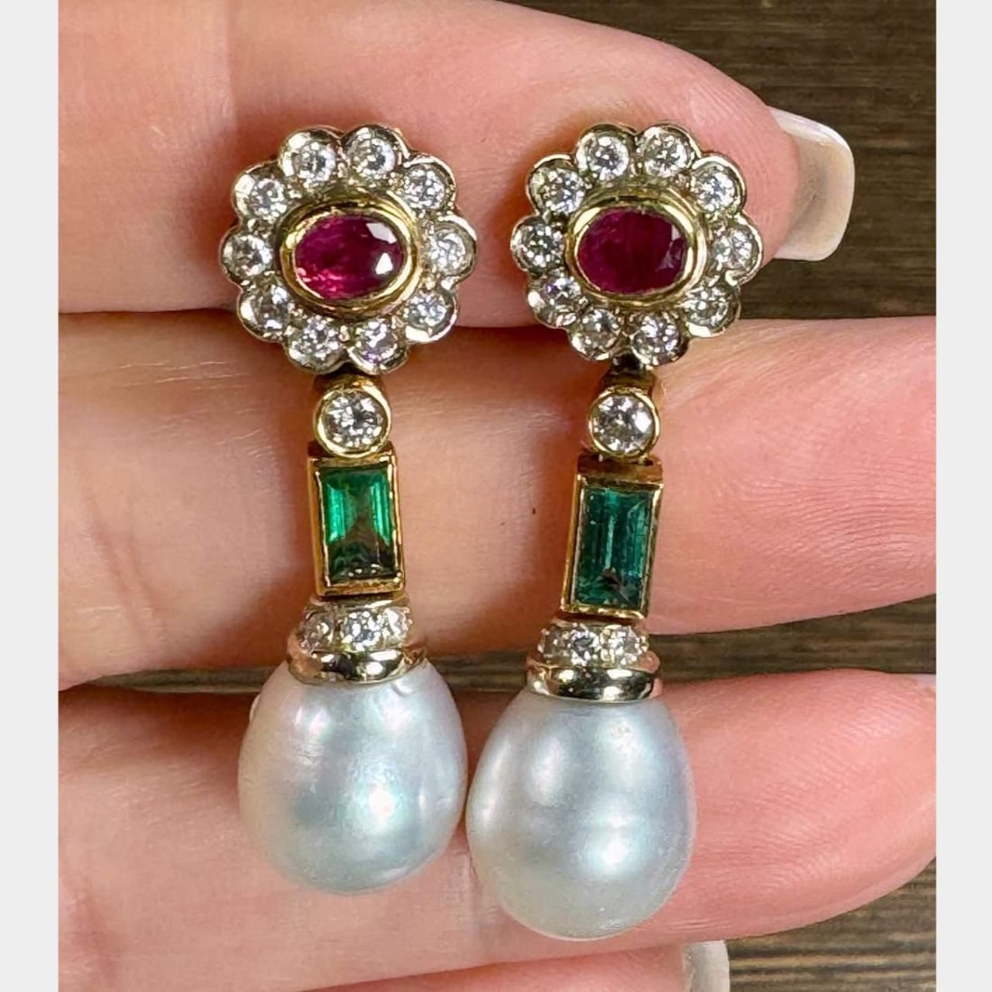 Elegant 18K Yellow Gold Pearl Tourmaline Ruby Diamond Earrings: Elegant 18K Yellow Gold Pearl Tourmaline Ruby Diamond Earrings These exquisite earrings are crafted in 18K yellow gold and feature stunning South Sea pearls, vibrant tourmalines, rich rubies, and spar
