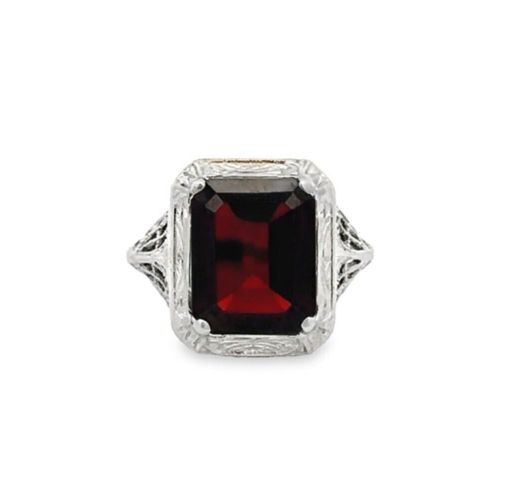 Antique Art Deco 3.27ct Garnet White Gold Floral Filigree Ring: Antique Art Deco 3.27ct Garnet White Gold Floral Filigree Ring This exquisite Antique Art Deco ring features a stunning rectangular step cut garnet, weighing 3.27 ct, elegantly set in solid 13-14k whi