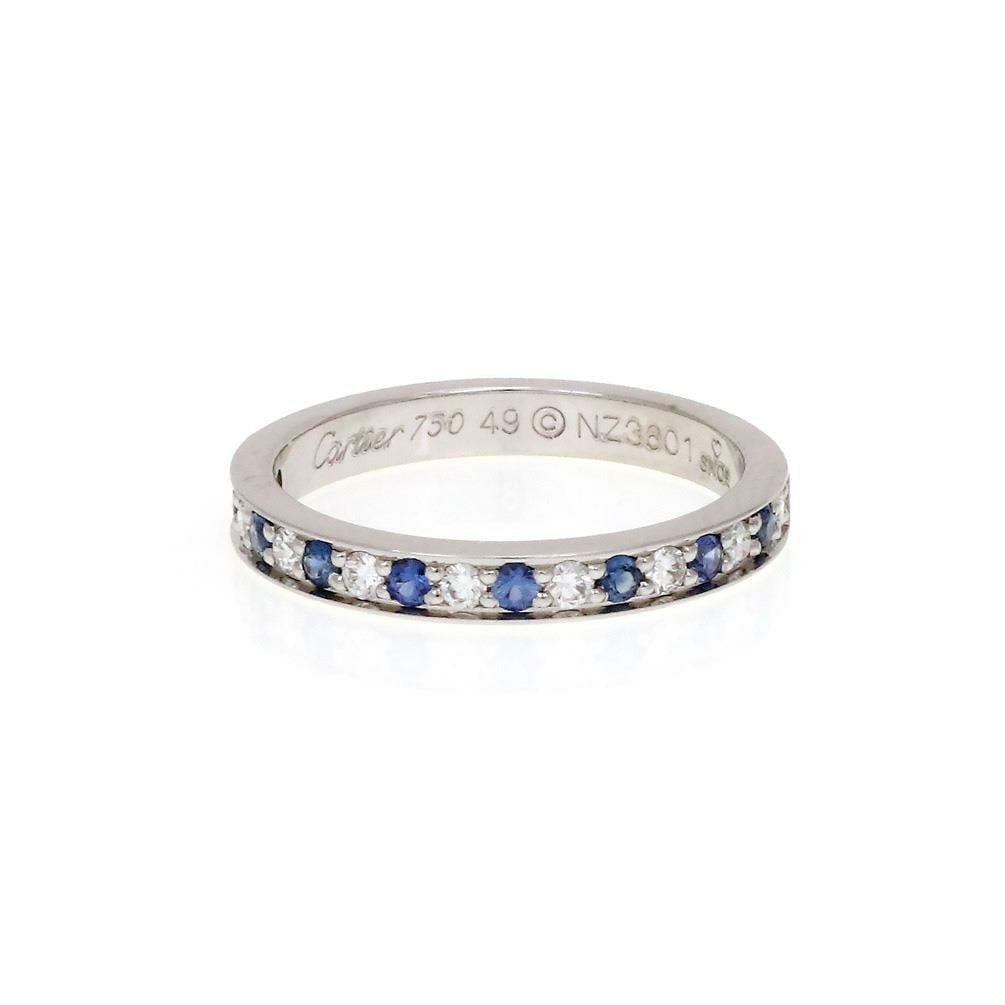 Cartier 18k White Gold Sapphire Diamond Ring Size 49 US 5 with Certificate: Cartier 18k White Gold Sapphire Diamond Ring Size 49 US 5 with Certificate This exquisite Cartier ring is crafted from luxurious 18k white gold and features a 2.5mm wide band. The front half showcases
