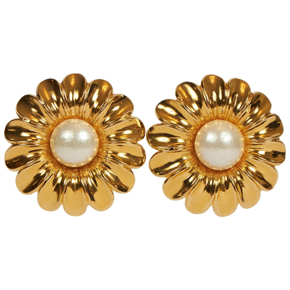 Rare 1970s Chanel Oversized Daisy Clip Earrings with Faux Pearl: Rare 1970s Chanel Oversized Daisy Clip Earrings with Faux Pearl Elevate your accessory collection with these rare 1970's Chanel oversized daisy clip earrings. Featuring a striking design, these earrin