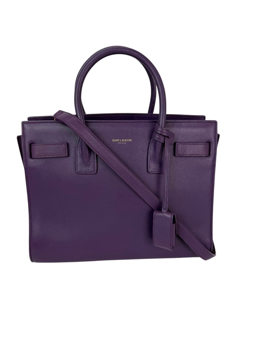 Saint Laurent Sac De Jour Purple Leather Shoulder Bag with Gold Hardware: Saint Laurent Sac De Jour Purple Leather Shoulder Bag with Gold Hardware Elevate your style with the Saint Laurent Sac De Jour Shoulder Bag, crafted from premium purple leather. This medium-sized, rec