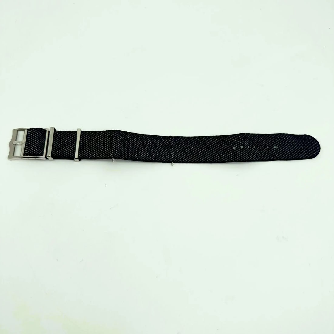 Tudor Blue Jean Nato Strap 4347130 for Tudor Black Bay Wristwatch: Tudor Blue Jean Nato Strap 4347130 for Tudor Black Bay Wristwatch Enhance your Tudor Black Bay with the Tudor Blue Jean Nato Strap 4347130. This sporty wristwatch band is crafted from durable blue jea