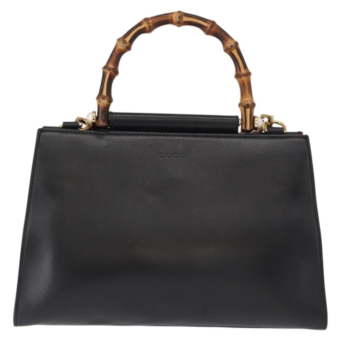 Nymphaea Bamboo Handle Handbag by Gucci in Black: Nymphaea Bamboo Handle Handbag by Gucci in Black This pre-owned Gucci Nymphaea top handle bag features a bamboo handle and showcases the iconic Sherry line design in black. It is in good condition wit