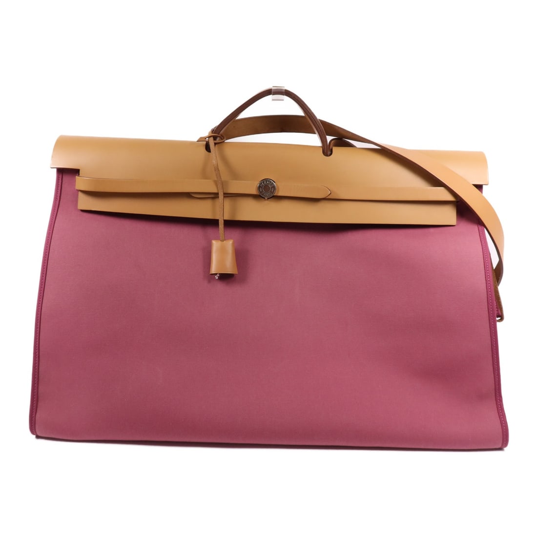 HERMES Herbag 50 2 Way Shoulder Bag Canvas Pink: HERMES Herbag 50 2 Way Shoulder Bag Canvas Pink Introducing the exquisite HERMES Herbag 50, a versatile 2-way shoulder bag crafted from durable canvas in a vibrant tosca pink hue. This stylish bag fea