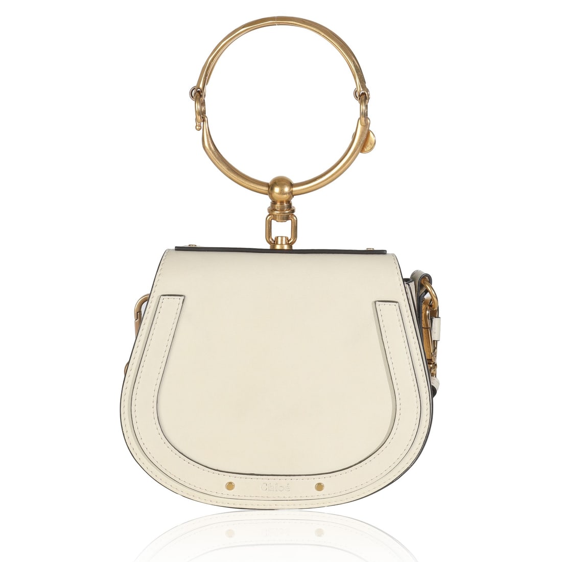 Small Nile Bracelet Top Handle White Leather Bag by Chloe: Small Nile Bracelet Top Handle White Leather Bag by Chloe The Chloe Small Nile Bracelet Bag features a neutral white leather exterior with gold-tone hardware and a distinctive top handle design. This