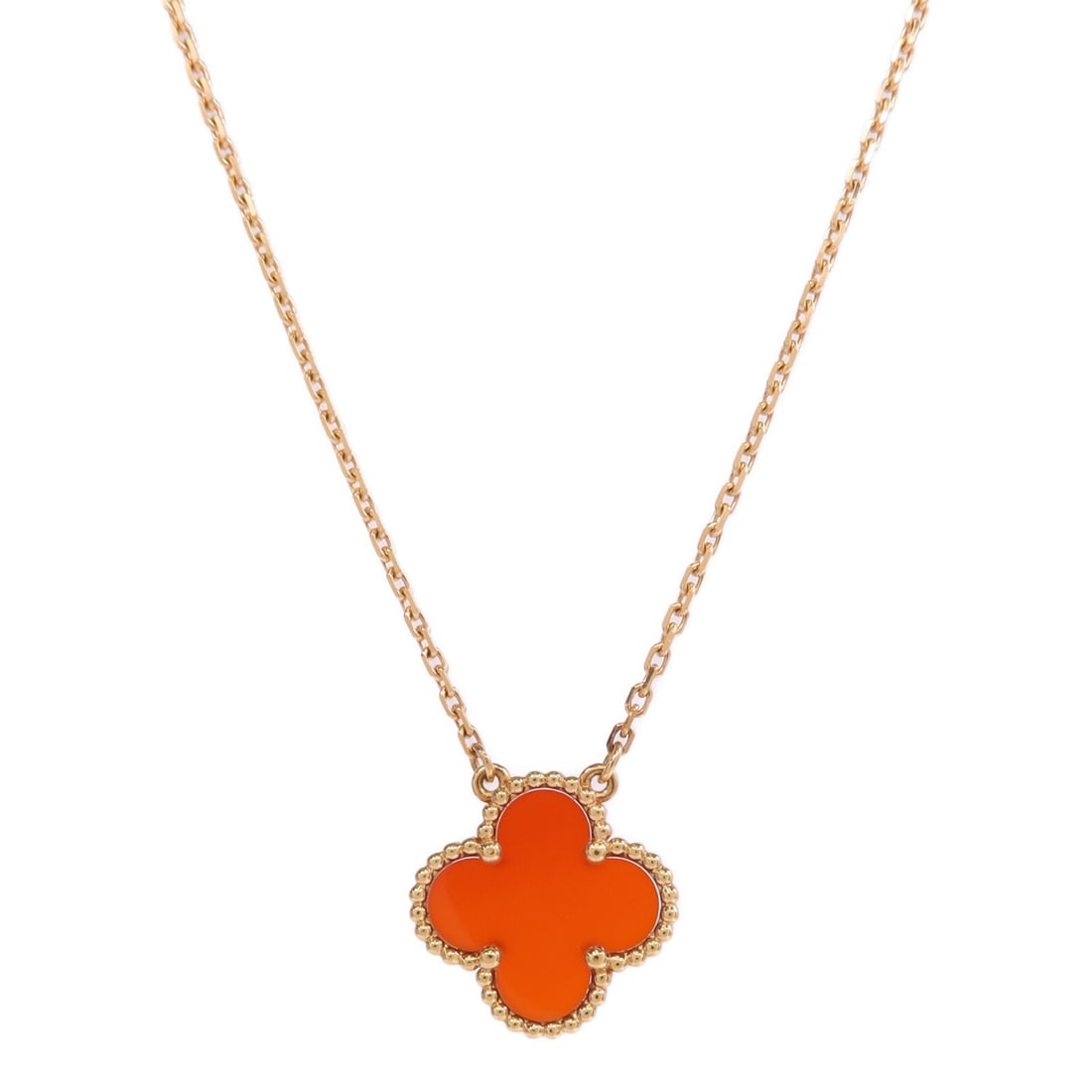 Vintage Alhambra Necklace with Carnelian Pendant in 18K Yellow Gold VCARD38500: Vintage Alhambra Necklace with Carnelian Pendant in 18K Yellow Gold VCARD38500 This Van Cleef & Arpels Vintage Alhambra pendant necklace features a classic clover motif crafted in 18K yellow gold, set
