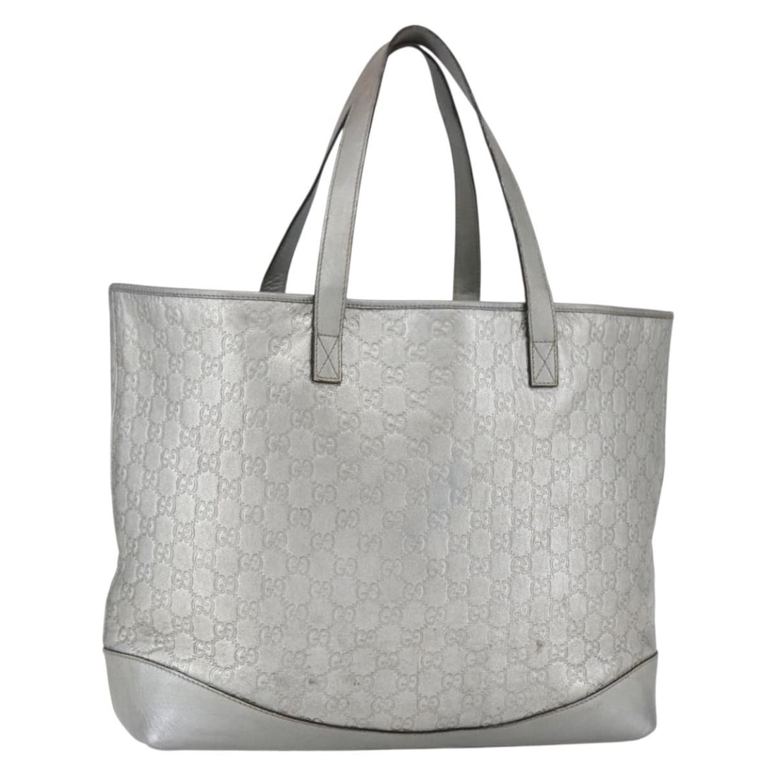 Gucci Plus Silver Tote Bag with Signs of Wear: Gucci Plus Silver Tote Bag with Signs of Wear This pre-owned Gucci Plus tote bag is designed for women and features a spacious main compartment. It shows signs of wear including surface rubbing, stain