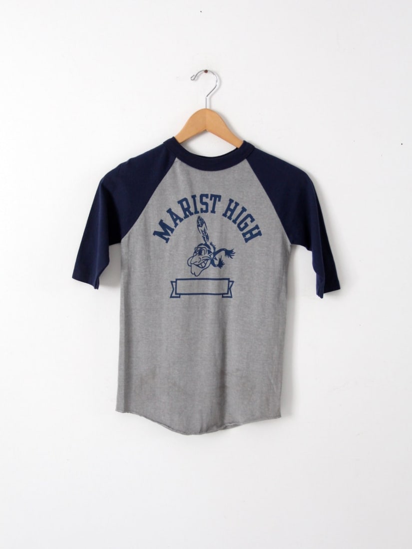 1980s Marist High School Vintage Baseball Tee Gray Navy: 1980s Marist High School Vintage Baseball Tee Gray Navy Celebrate nostalgia with this 1980s vintage graphic t-shirt from Marist High School. This charming small baseball tee features a classic gray bo