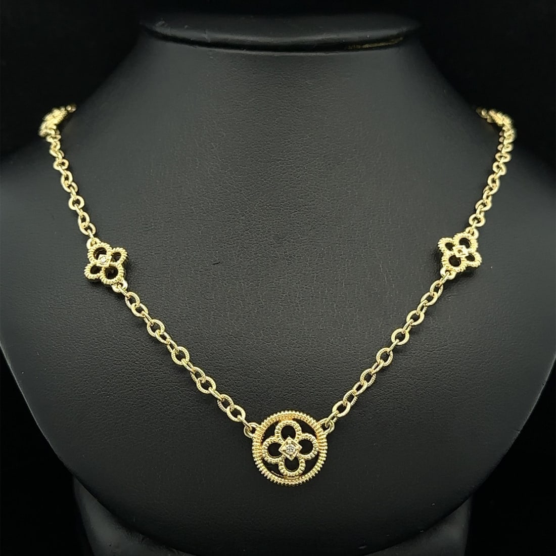 14k Yellow Gold Floral Diamond Cable Design Necklace 17": 14k Yellow Gold Floral Diamond Cable Design Necklace 17" This exquisite 14k Gold Diamond Necklace features a stunning floral open work design with a textured cable link chain. Adorned with seven natur