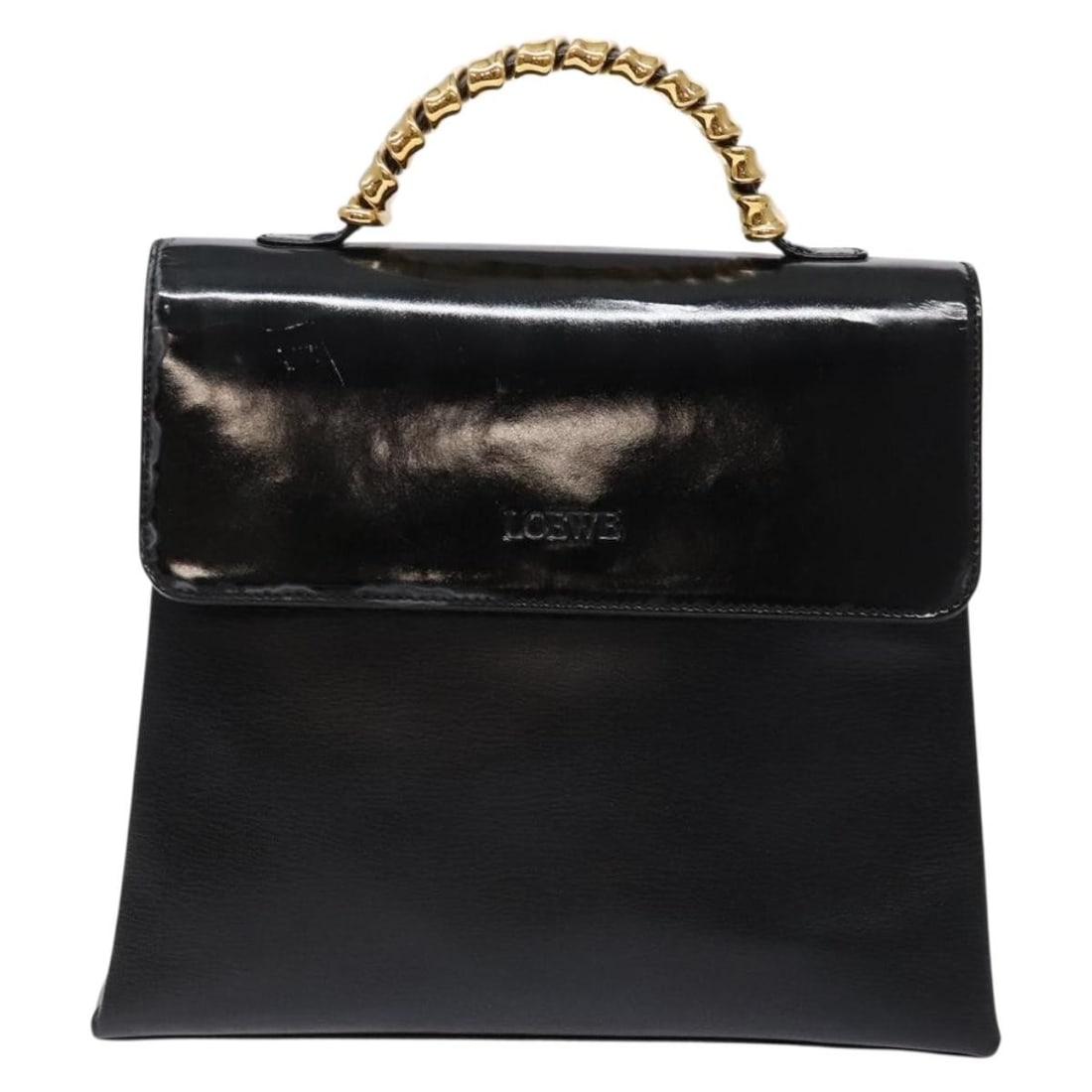 Velazquez Black Top Handle Bag by Loewe Vintage Collection: Velazquez Black Top Handle Bag by Loewe Vintage Collection This Loewe Vintage Velazquez Top Handle Bag features a classic black exterior with a structured shape. The bag shows some signs of previous u