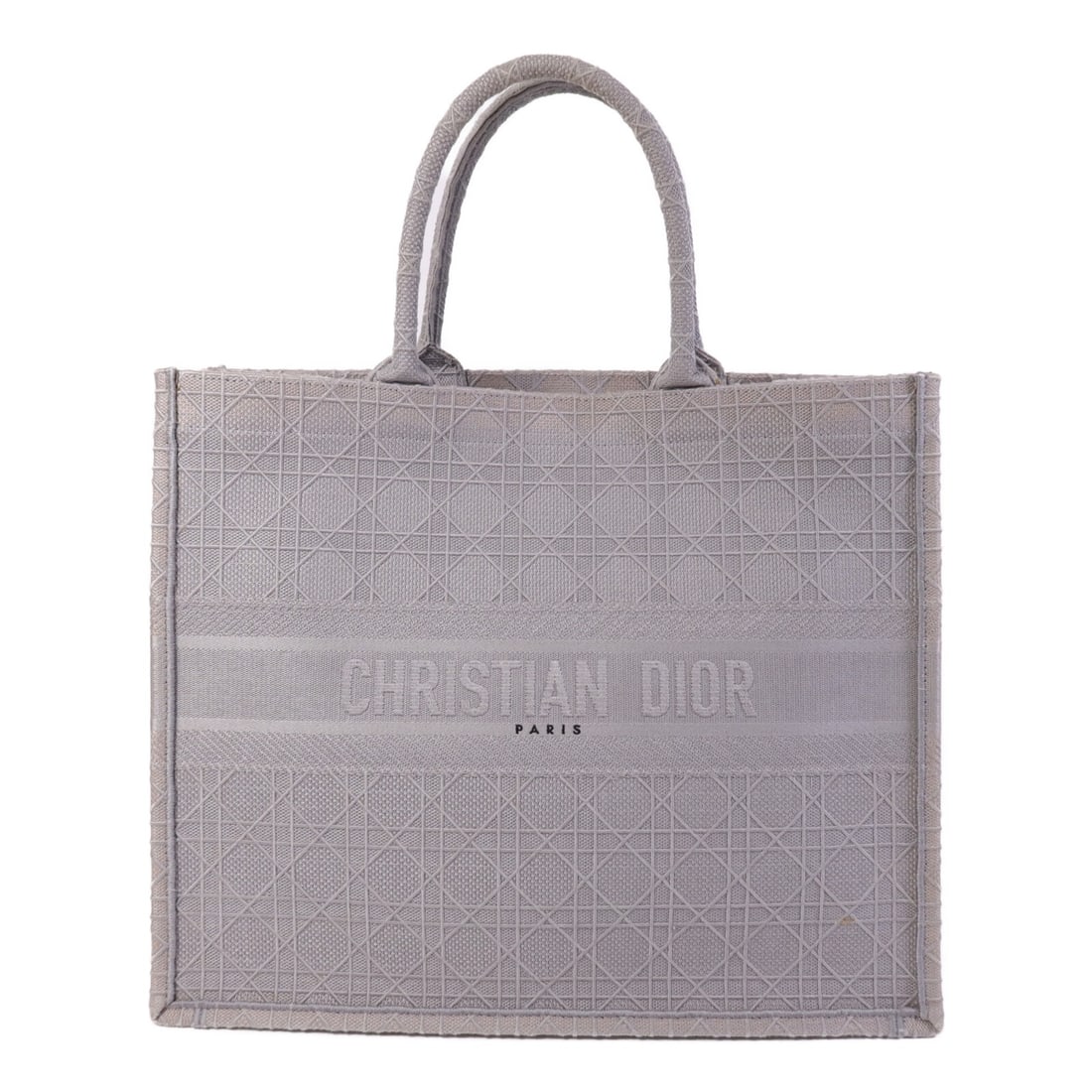 Dior Christian Dior Gray Canvas Book Tote Bag: Dior Christian Dior Gray Canvas Book Tote Bag Elevate your style with this Christian Dior CD Book Tote Bag, crafted from durable gray canvas. This sophisticated tote features a spacious interior, perf