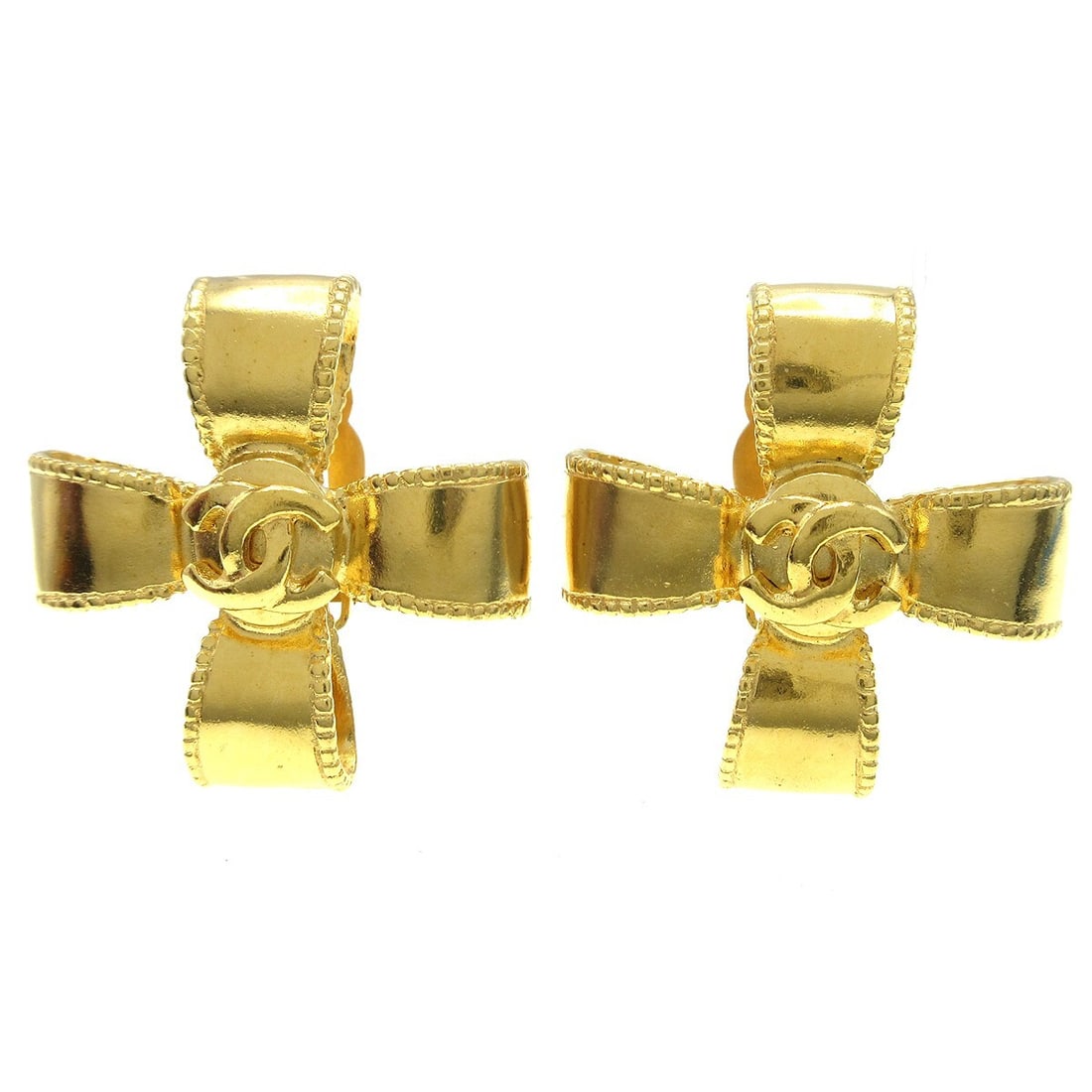 CC Clover Clip-On Earrings by Chanel in Gold Tone Vintage: CC Clover Clip-On Earrings by Chanel in Gold Tone Vintage These vintage Chanel CC Clover clip-on earrings feature a gold tone finish and showcase the iconic Chanel design. Suitable for female wearers,