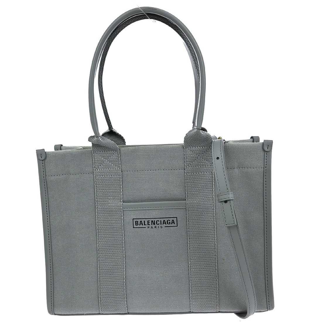 Balenciaga Gray Canvas 2Way Handbag with Logo Accents: Balenciaga Gray Canvas 2Way Handbag with Logo Accents This Balenciaga gray canvas handbag is a stylish and versatile accessory perfect for casual occasions. With a compact size of 9 in width, 7 in hei