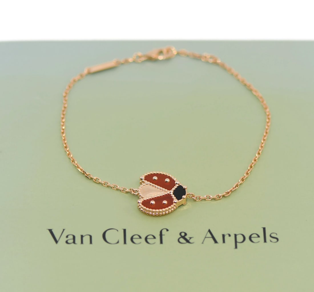 Van Cleef & Arpels Lucky Spring Ladybug 18K Rose Gold Charm Bracelet: Van Cleef & Arpels Lucky Spring Ladybug 18K Rose Gold Charm Bracelet Adorn your wrist with the exquisite Van Cleef & Arpels Lucky Spring Ladybug Bracelet. Crafted from luxurious 18K rose gold, this ch