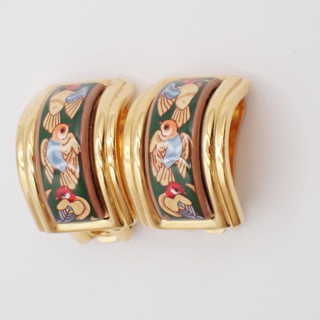 Vintage Half Hoop Clip-On Earrings by Hermes Gold Tone: Vintage Half Hoop Clip-On Earrings by Hermes Gold Tone These vintage Hermes half hoop clip-on earrings feature a gold-tone finish and are designed for female wearers. The pair is pre-owned and in very