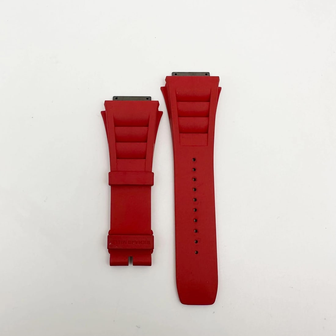 Richard Mille Red Rubber Two-Piece Wristwatch Band 18mm: Richard Mille Red Rubber Two-Piece Wristwatch Band 18mm Elevate your wristwatch with this Richard Mille Red Rubber Band. This luxurious two-piece strap is designed specifically for Richard Mille watch